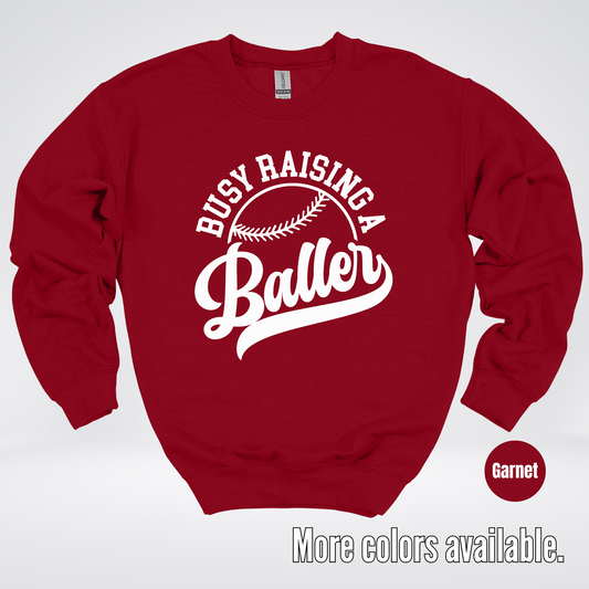 Busy Raising A Baller – White Design – Baseball Softball Crewneck Sweatshirt